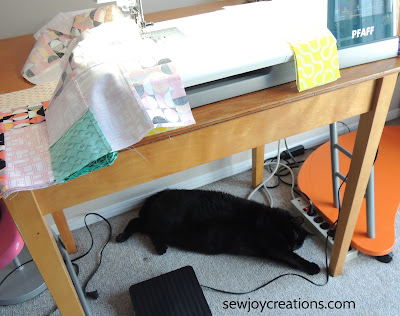 cat in sewing room chain piecing