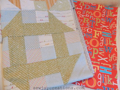 bright happy alphabet backing for a baby quilt peek at baby churn and backing