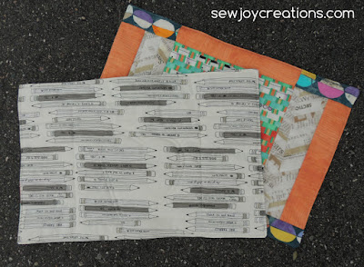 The backing is the pencil fabric from Cotton and Steel because I like to write down my Stories. Front fabric is Story by Carrie Bloomston. Cotton and Steel pencils for backing.
