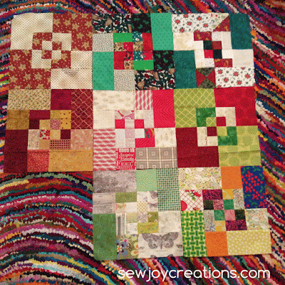 my scrappy bento box blocks on my funky carpet! my birthday blocks