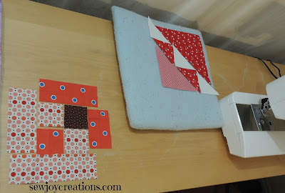 using blocks as leader and ender of each other lined up on sewing table