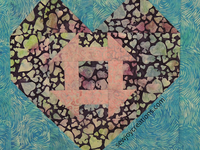 close up of Heart and Churn quilt Love and Kisses fabric Heart and Churn quilt pattern