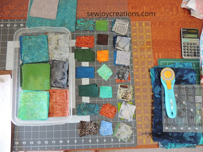cutting up fabrics to make all sizes of blocks prepping fabric for small blocks
