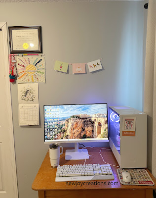 Space above my computer before wall space above computer on desk in sewing room