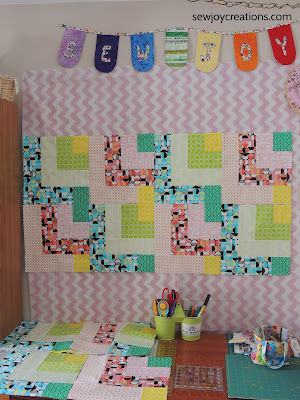 Dropping In quilt taking shape on design wall design wall Dropping In quilt Good Vibes fabric