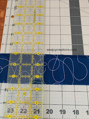 cut the measured fabric strip with a ruler