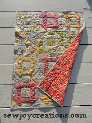 baby quilt with backing showing