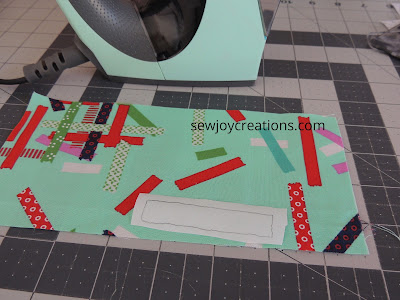 fussy cutting Christmas fabric for the iron block