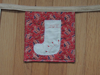 completed stocking with radiant stitch radiant stitch joy stocking stocking banner QUILTsocial project