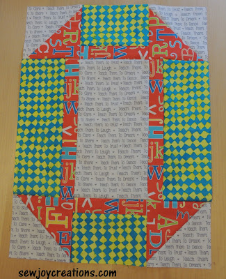 large bright churn dash made with leftovers bright churn dash block