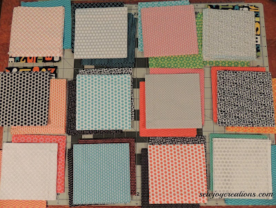 Fabrics sorted with light churn dash fabric and two background fabrics