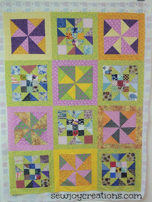quilt top  bright colours bordered blocks