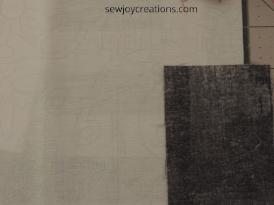 needle and scissors in the background fabric