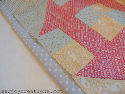 peek at a baby quilt with churn dashes - of course! peek at four patch baby churn