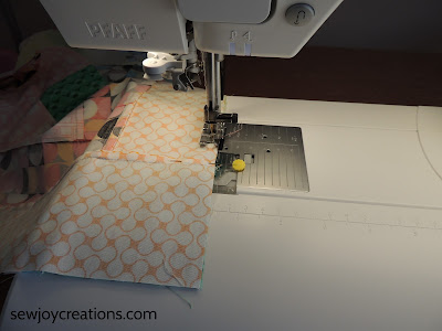 blocks pinned at nesting seam sewing blocks together PFAFF performance icon