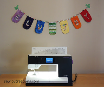 Sew Joy quilted banner for QUILTsocial PFAFF quilt expression 720 quilted banner project