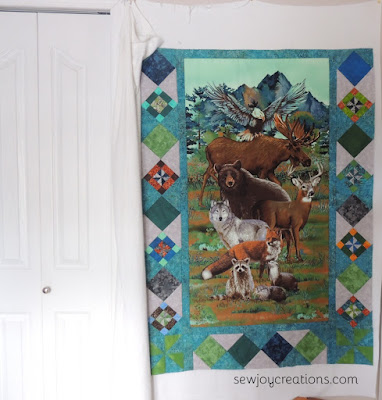 the panel quilt growing with an on point border panel quilt on point border