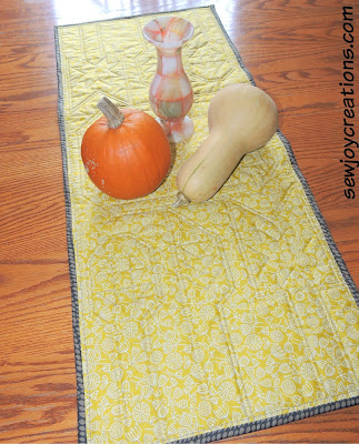 reverse side of patchwork utensil runner reversible quilted table runner
