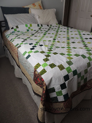 irish chain quilt top on queen size bed