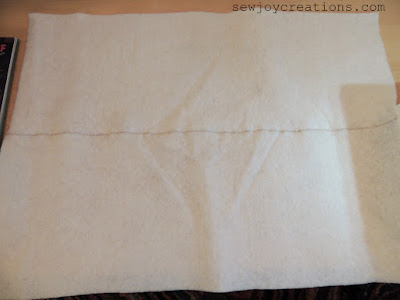 Sew pieces of batting together to get the size you need with an overlock stitch sewn batting