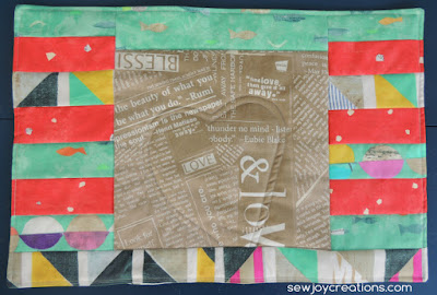 Striped Delight placemat in Story fabric on blue background