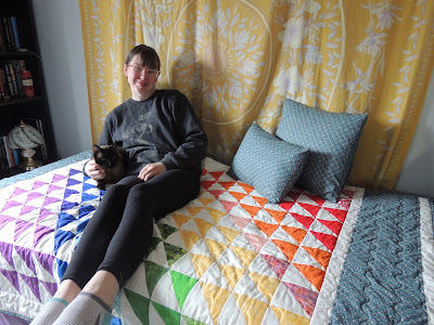 daughter, quilt and cat rainbow quilt