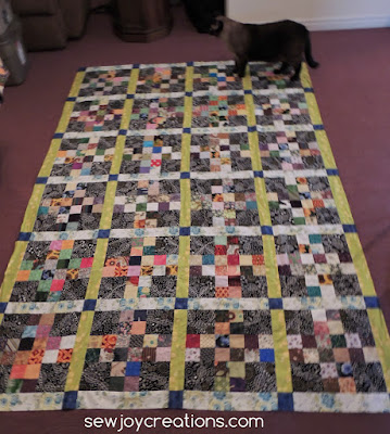 My Traffic Jam quilt getting a final feline once over before going to get quilted Traffic Jam scrap challenge from Pat Sloan