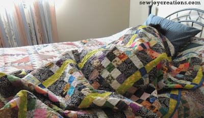 a quilt in use makes me happy! traffic jam quilt in use