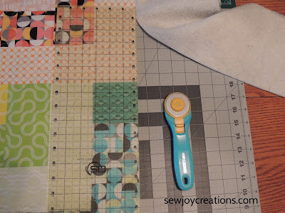 trimming the excess batting and backing trimming quilted top