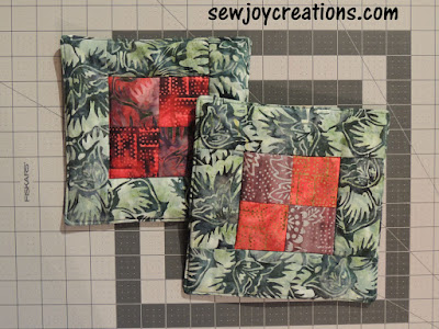 two potholders made using leftovers from same project two pieced potholders scrap fabric batik project