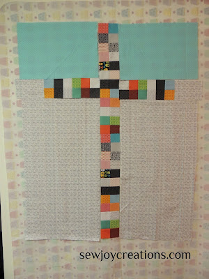 reverse side of baby quilt made of leftover 2 patches