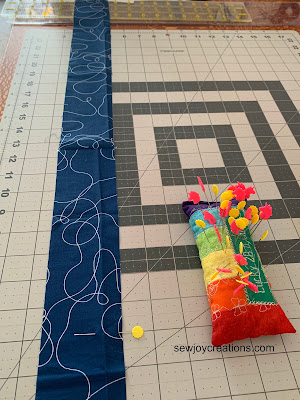 with the pin at 0 now lay remaining strip out across the cutting mat