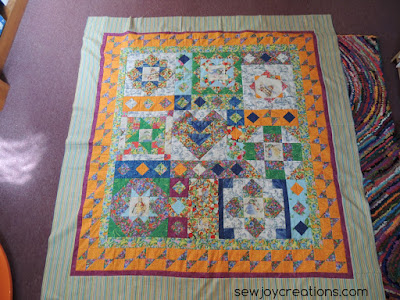 vacation time quilt top on studio floor