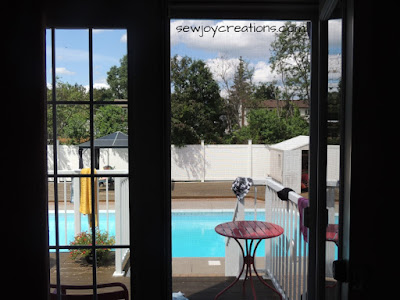view from my sewing space outdoor inground pool view